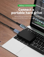 A portable hard drive connected to a laptop using the USB Type C cable. The image highlights 40Gbps data transmission speed, emphasizing fast file transfers.