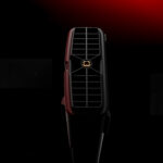 Rear exhaust port of the AYANEO AG01 Graphics Dock with a central screw mount, set against a dramatic red and black background.
