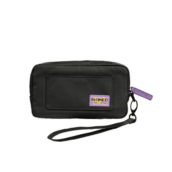 A rectangular black carrying case, designed for a handheld gaming device, is shown against a plain grey background. The case is made of a durable, textured fabric and features a small front pocket. A purple tag with "AYANEO" written on it is attached to the zipper. A black wrist strap is connected to the case via a small metal carabiner.