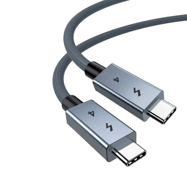 A close-up of a high-quality USB-4 cable featuring two USB-C connectors with space-grey metallic housings. The connectors are engraved with a lightning bolt icon and the number "4." The cable itself has a durable, grey braided nylon jacket, shown curved against a plain white background.