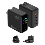 A detailed product graphic showing two views of the black DROIX 140W USB-C Wall Charger and its interchangeable international adapters. The top-left view displays the charger's matte black body with a glossy front screen. The display features a vibrant rainbow-colored circular ring around a "140 W" power indicator. The top-right view highlights the four output ports: three USB-C ports (labeled 40W, 100W, and 140W) and one orange USB-A port (22.5W). At the bottom, two snap-on travel adapters for UK and EU sockets are shown, highlighting the unit’s versatility for global travel.