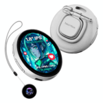 A white electronic badge with a round screen showing a blue, green, and red anime-style girl is shown. The screen displays text that reads "1.8” IPS TOUCHSCREEN" and "JPG / PNG / GIFS 3S videos" with small red heart icons to its side. A metal clip is attached to the back of the device. The device is hanging on a gray string attached to another smaller round device that is black with a glowing blue, purple, and green pattern in the center. The overall shape and color of the devices are reminiscent of round watches.